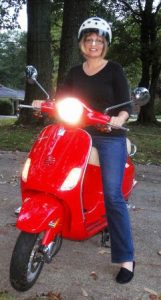 @helmetorheels blogger Pam on a Vespa